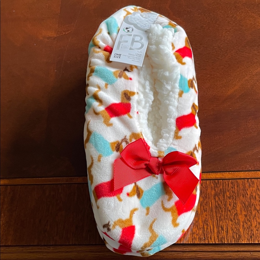 Slippers with dachshunds with no skid soles.